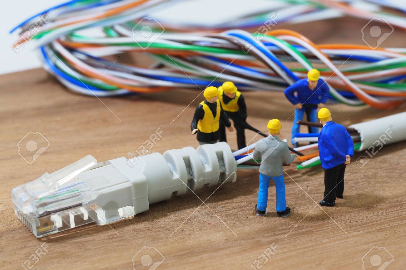 Group of engineer workers are repair LAN network connection Ethe